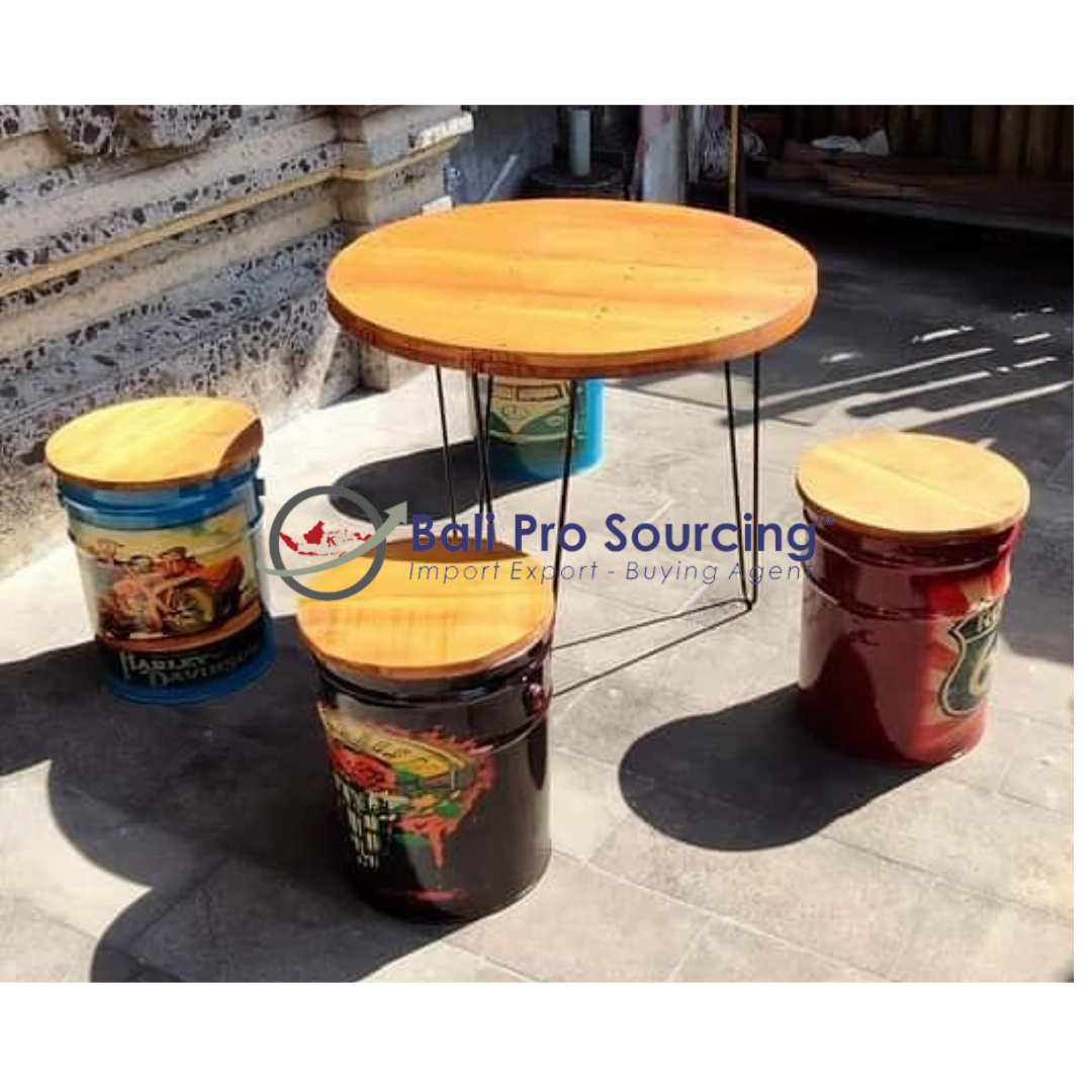 A Set Of Table And Recycled Drum Chairs